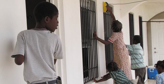 Children helping with home cleaning